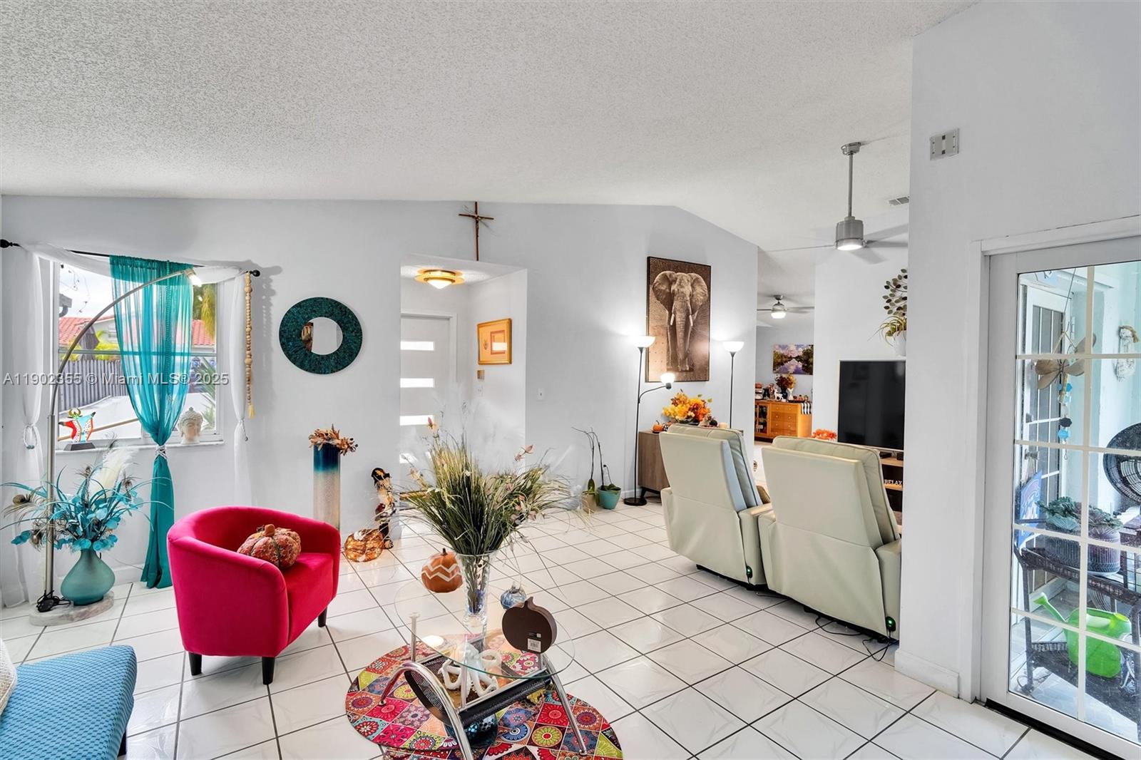 11035 Southwest 148th Place Miami, FL 33196 - Photo 9 of 48 a living room with furniture and a flat screen tv