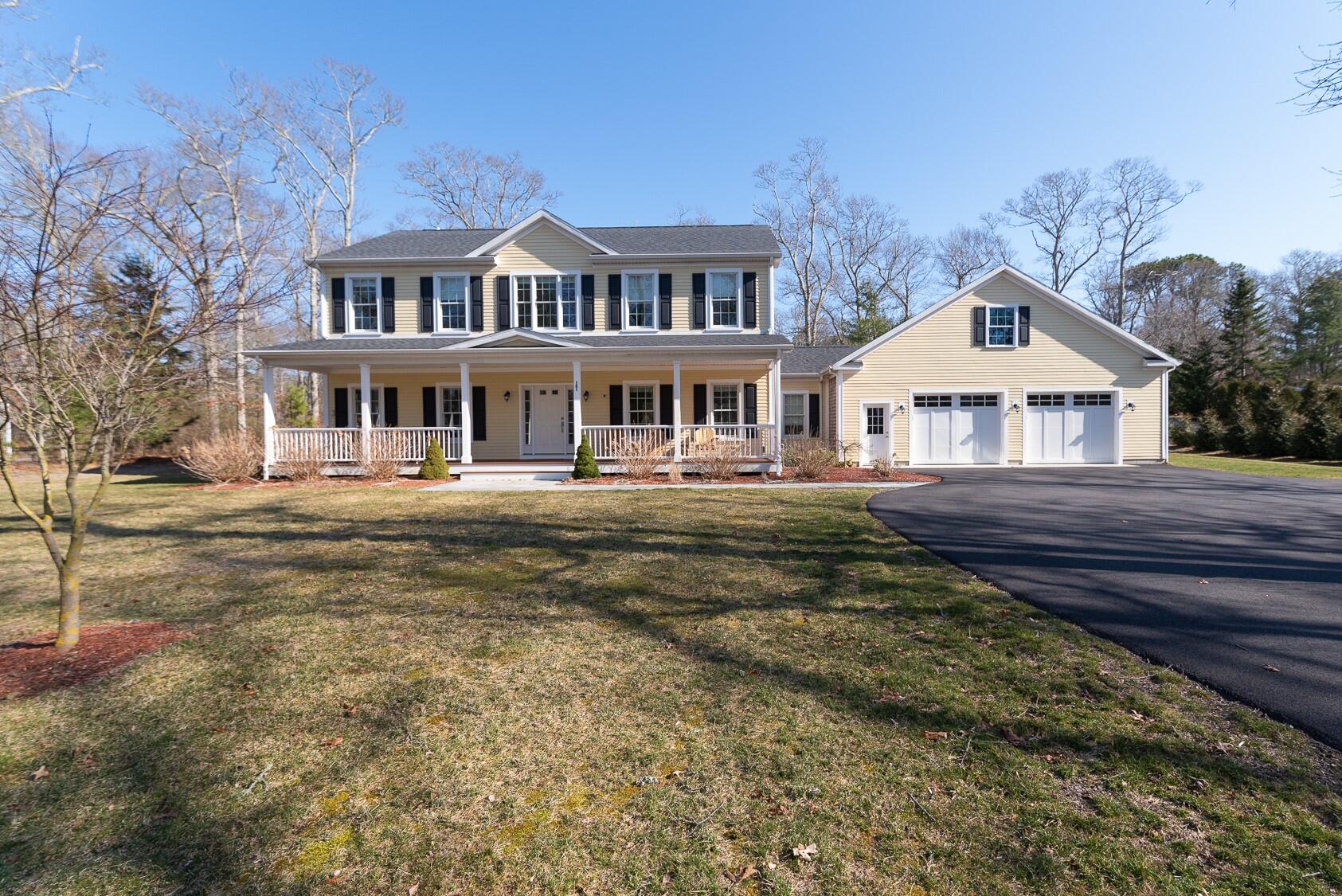 151 Tonset Road Orleans, MA 02653 - Photo 1 of 44 a front view of a house with a yard