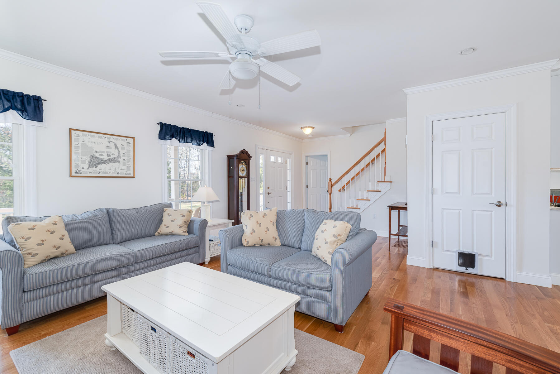 151 Tonset Road Orleans, MA 02653 - Photo 11 of 44 a living room with furniture and a wooden floor
