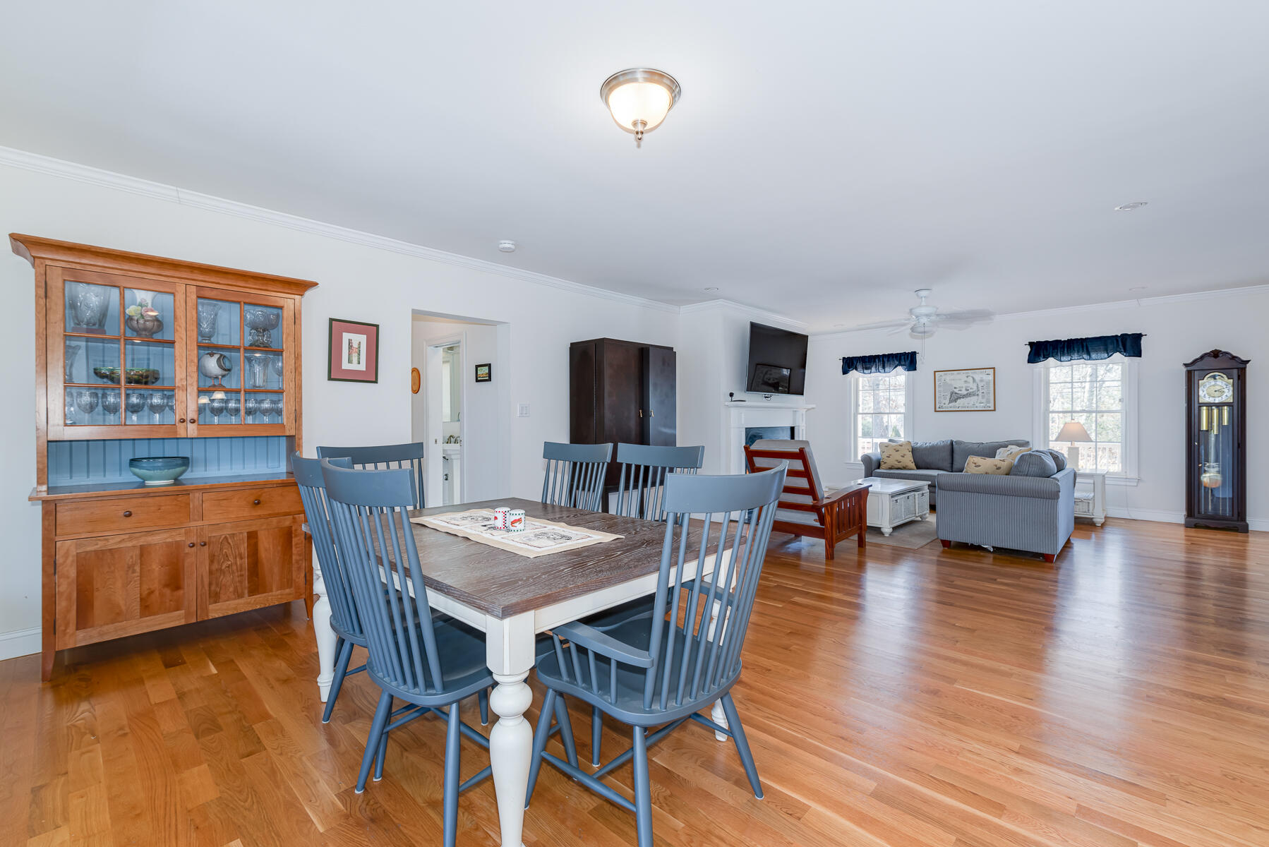 151 Tonset Road Orleans, MA 02653 - Photo 12 of 44 a view of a dining room with furniture and wooden floor