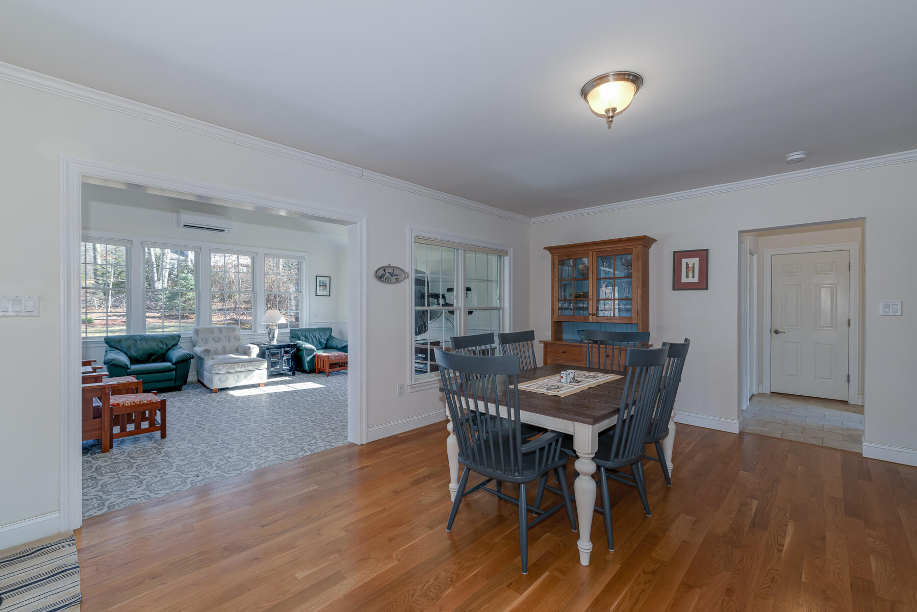 151 Tonset Road Orleans, MA 02653 - Photo 13 of 44 a view of a dining room with furniture and wooden floor