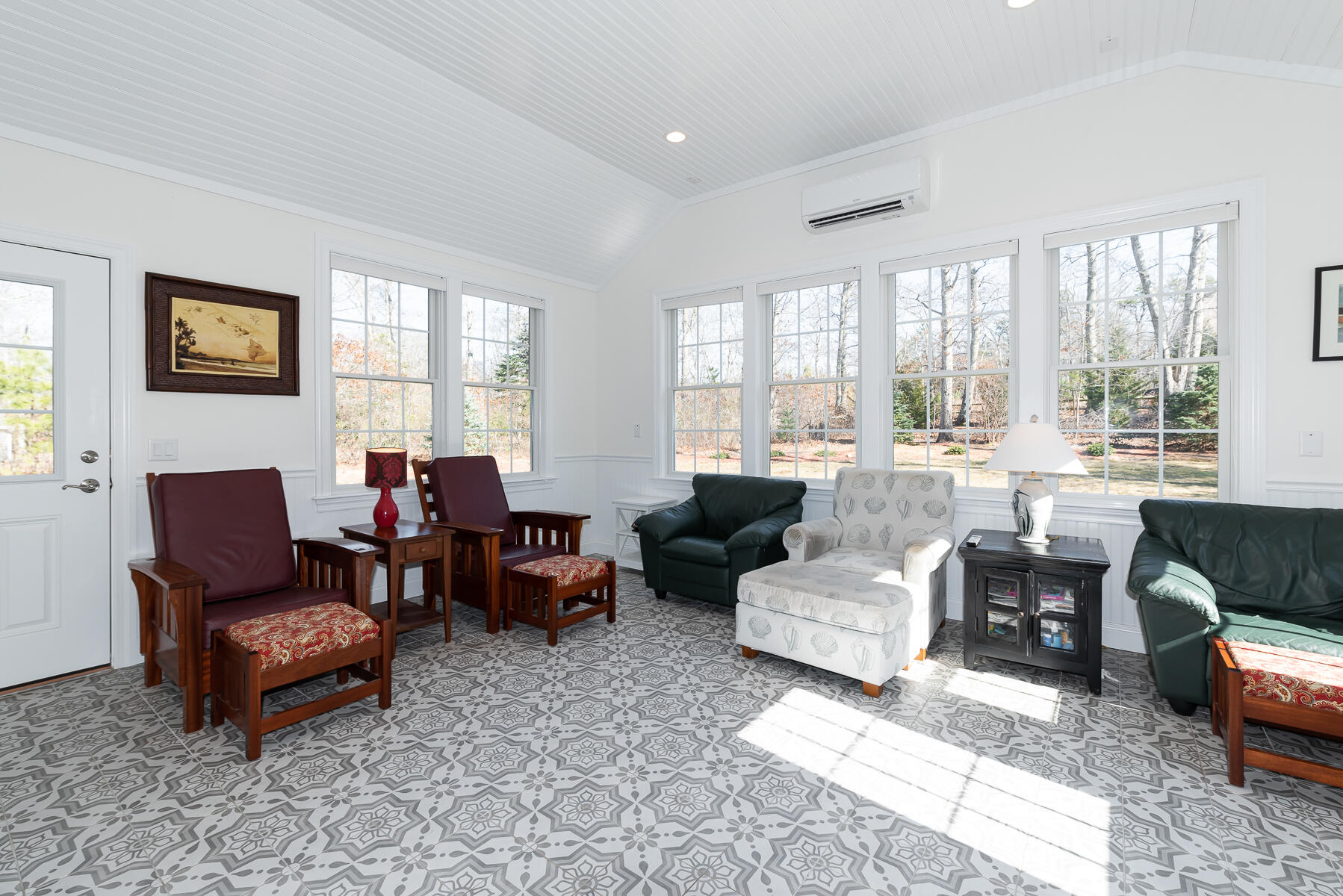 151 Tonset Road Orleans, MA 02653 - Photo 14 of 44 a living room with furniture and large windows