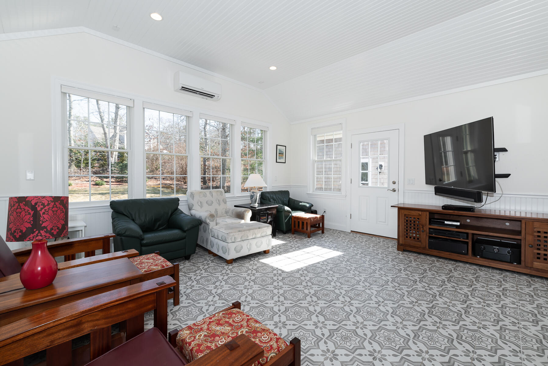 151 Tonset Road Orleans, MA 02653 - Photo 15 of 44 a living room with furniture and a flat screen tv