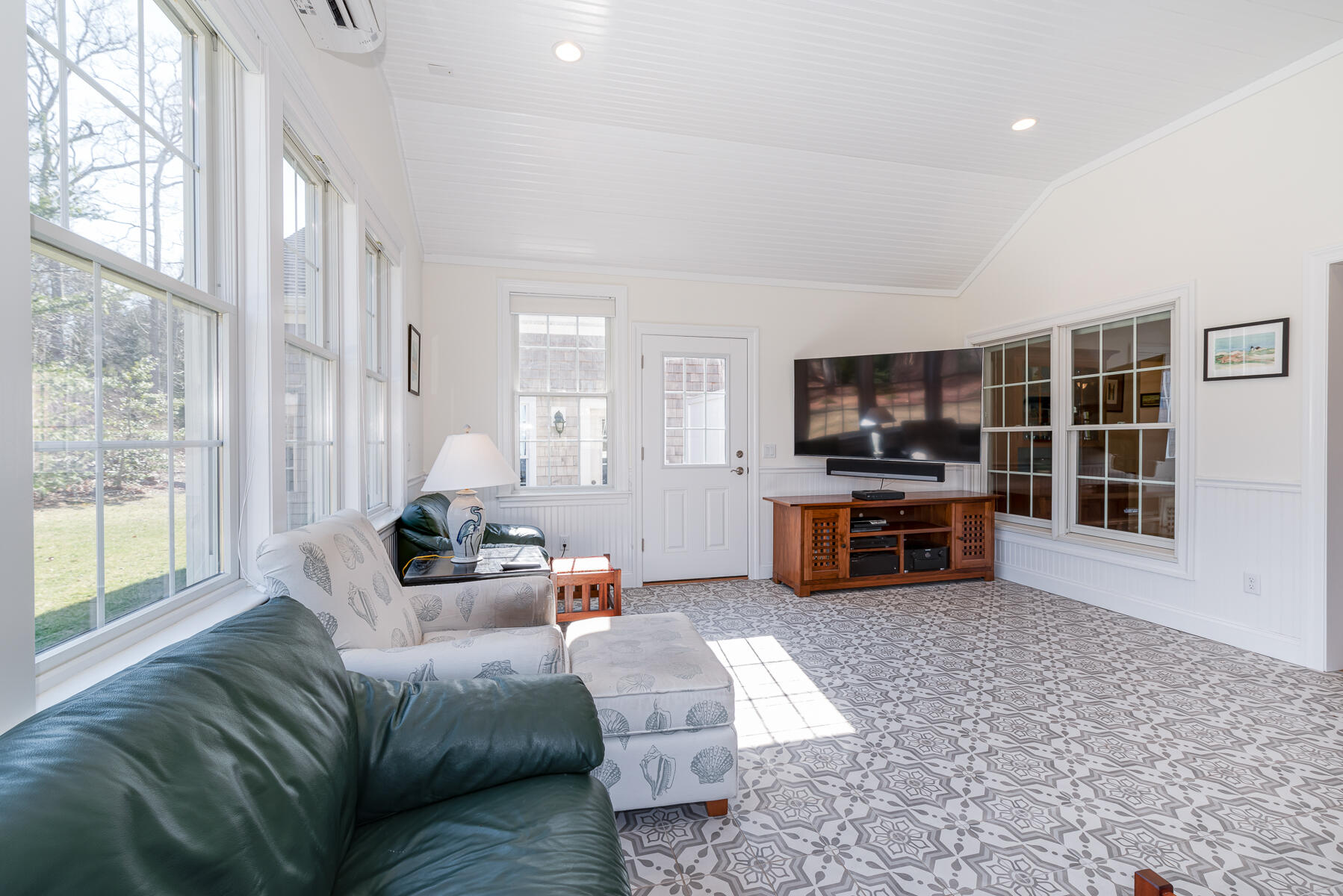 151 Tonset Road Orleans, MA 02653 - Photo 16 of 44 a living room with furniture and a flat screen tv