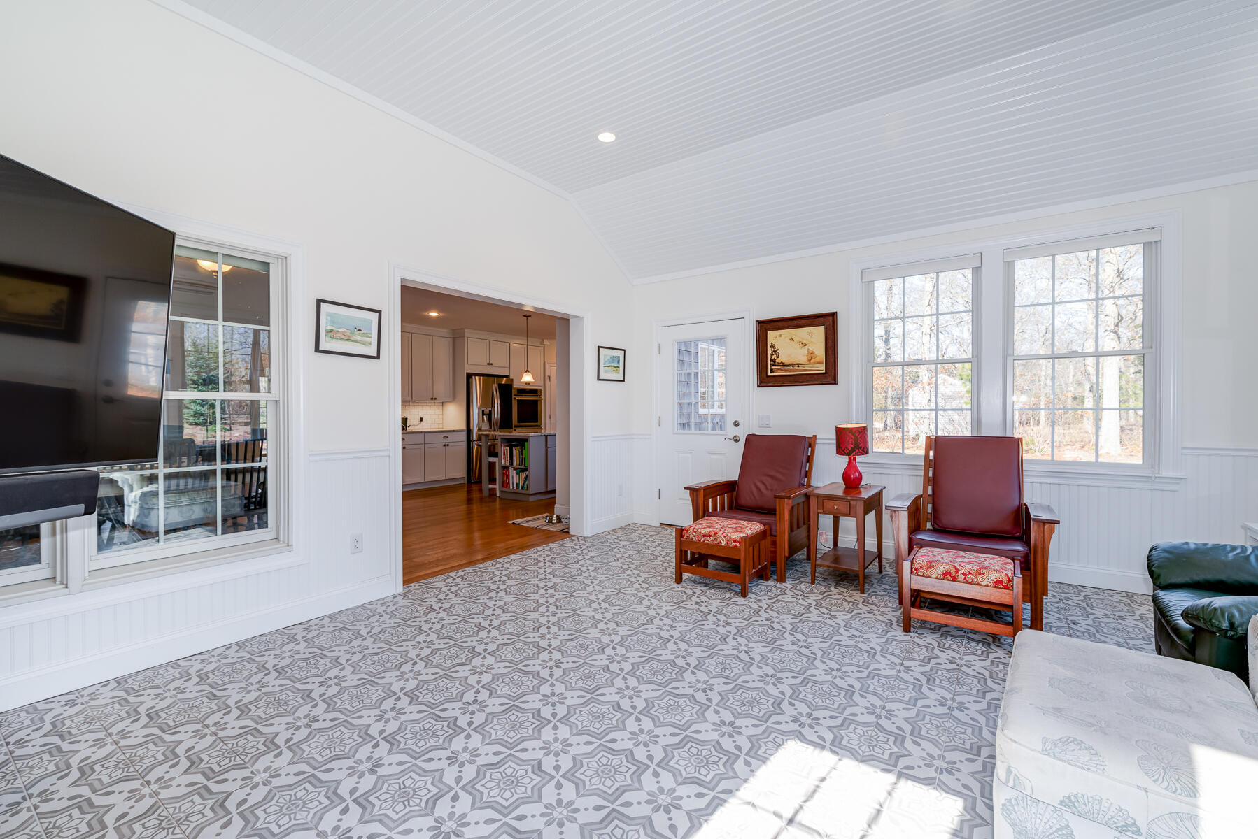 151 Tonset Road Orleans, MA 02653 - Photo 17 of 44 a living room with furniture and a flat screen tv