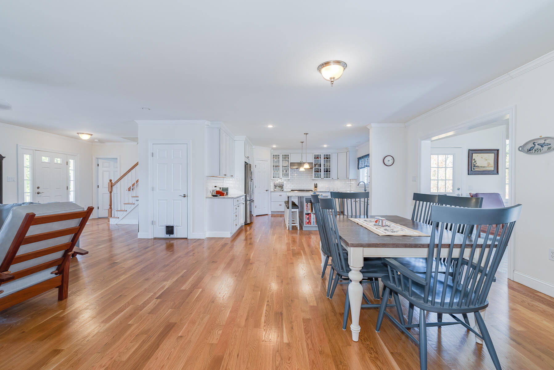 151 Tonset Road Orleans, MA 02653 - Photo 18 of 44 a dining room with furniture and wooden floor