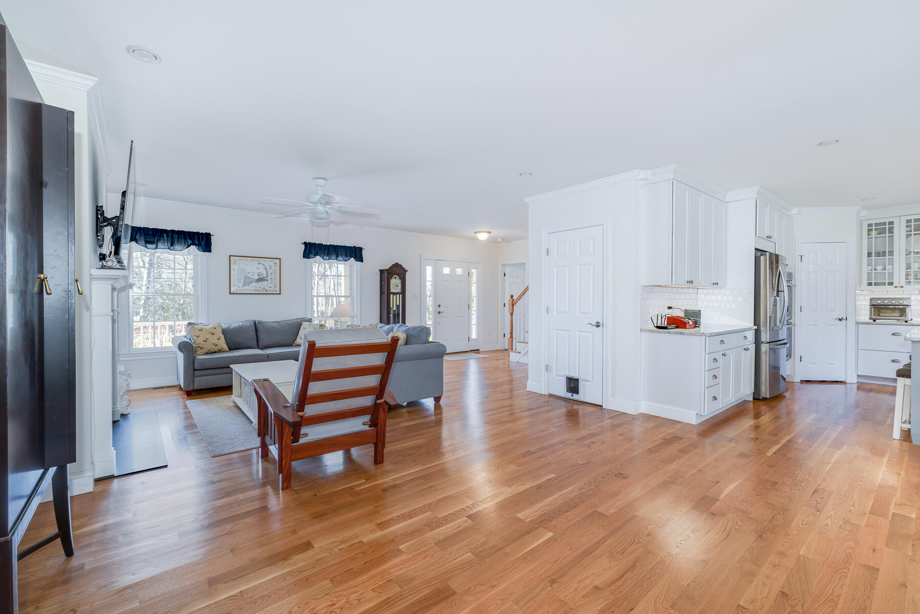 151 Tonset Road Orleans, MA 02653 - Photo 19 of 44 a living room with furniture and a table with wooden floor