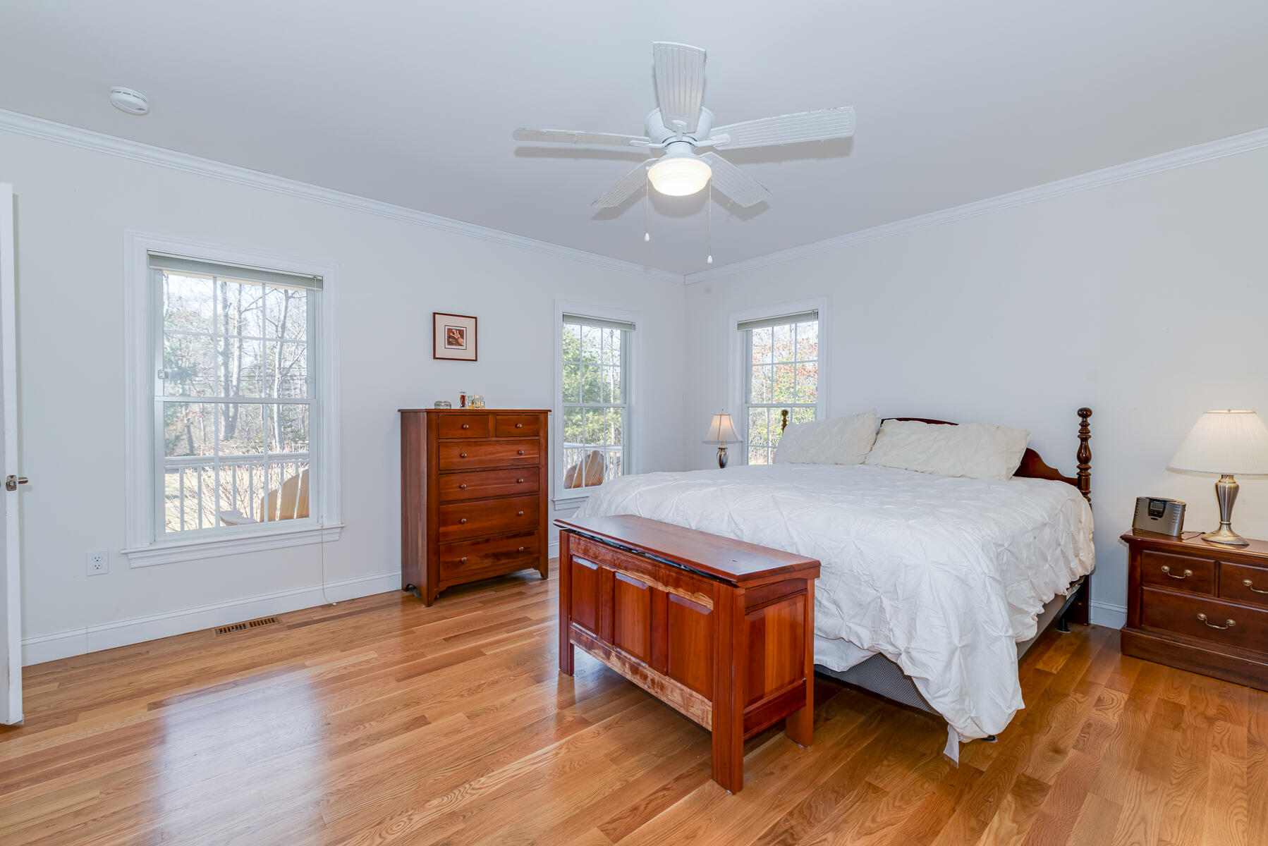 151 Tonset Road Orleans, MA 02653 - Photo 20 of 44 a spacious bedroom with a bed and wooden floor