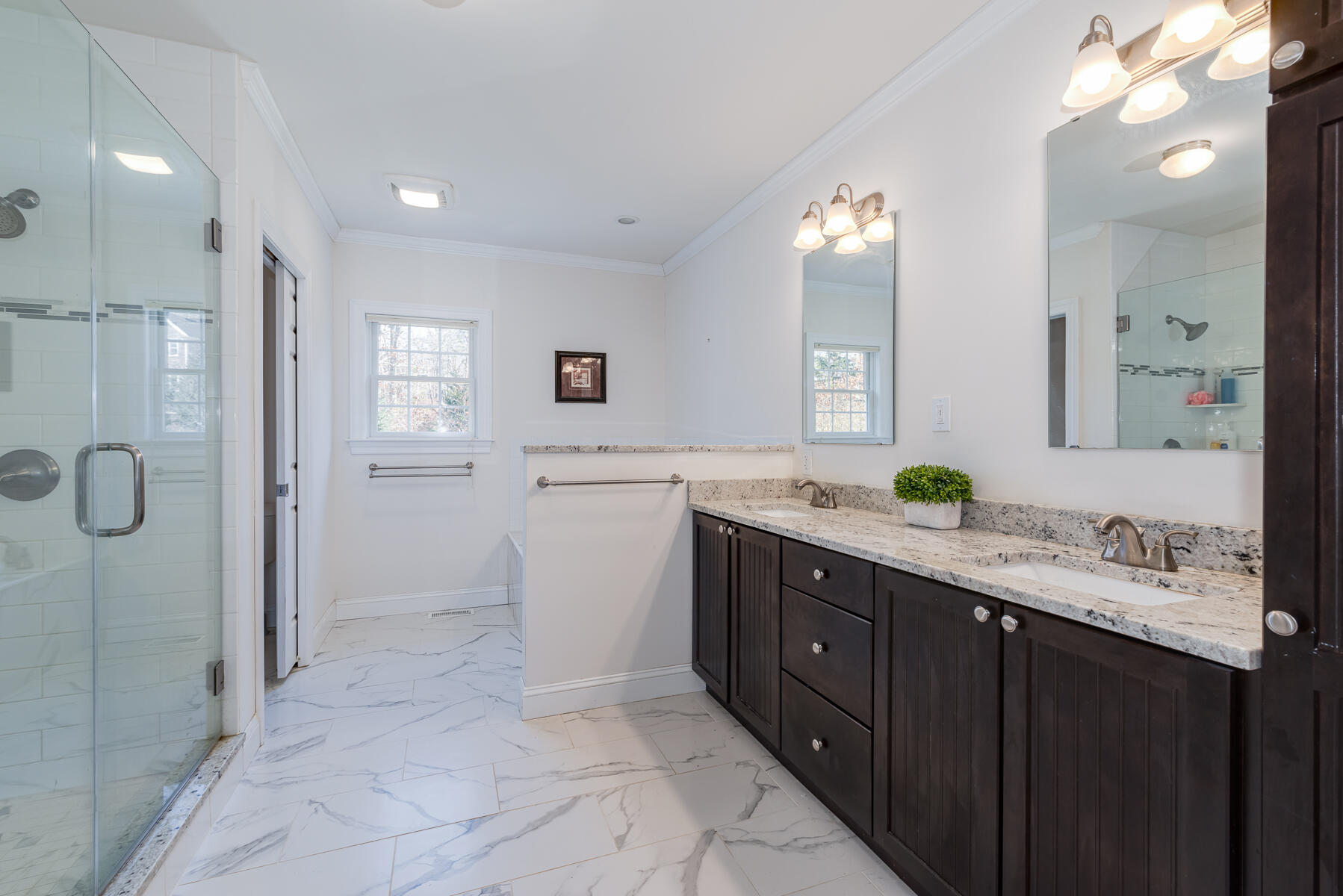151 Tonset Road Orleans, MA 02653 - Photo 21 of 44 a spacious bathroom with a double vanity sink mirror and shower