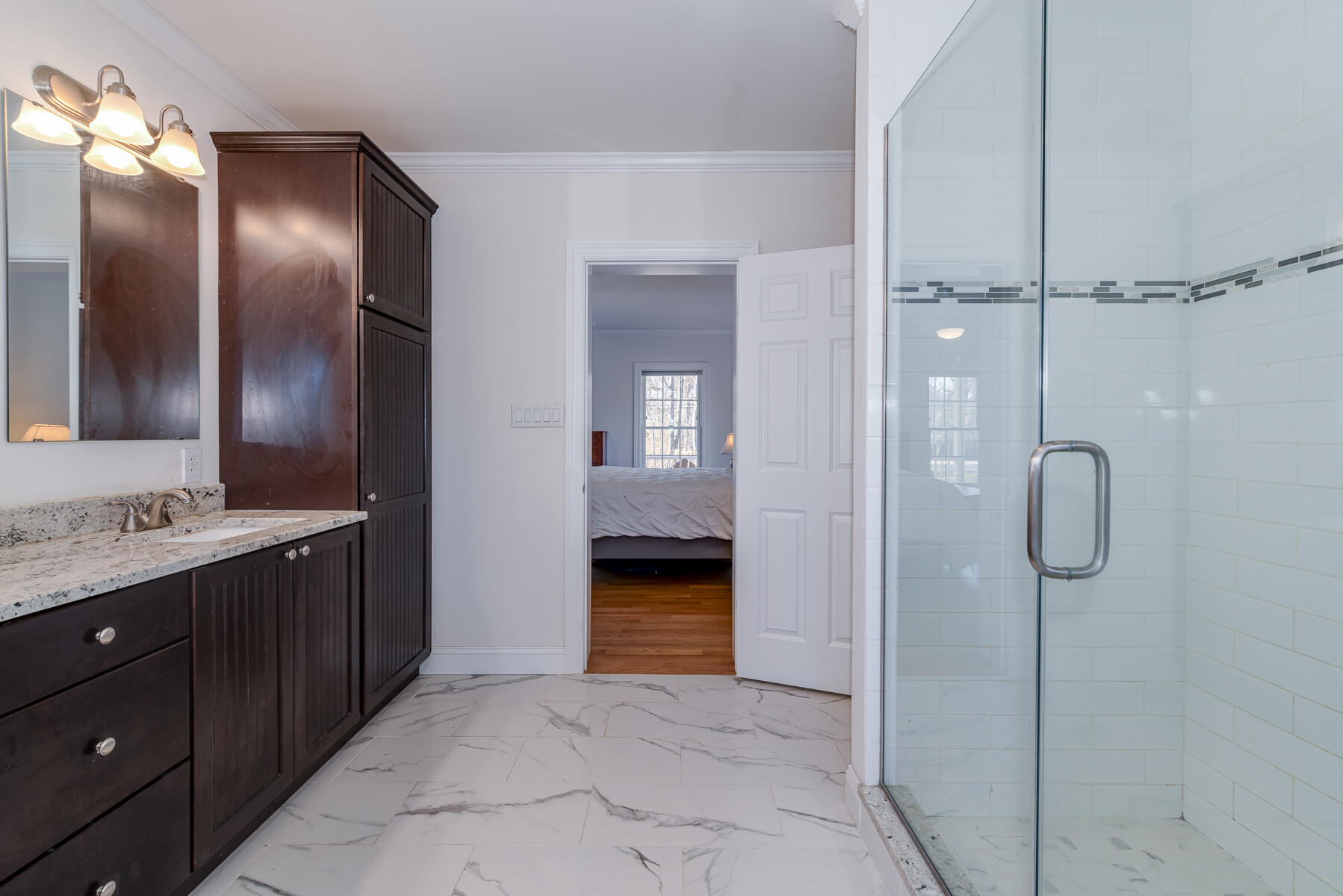 151 Tonset Road Orleans, MA 02653 - Photo 23 of 44 a bathroom with a double vanity sink and a mirror