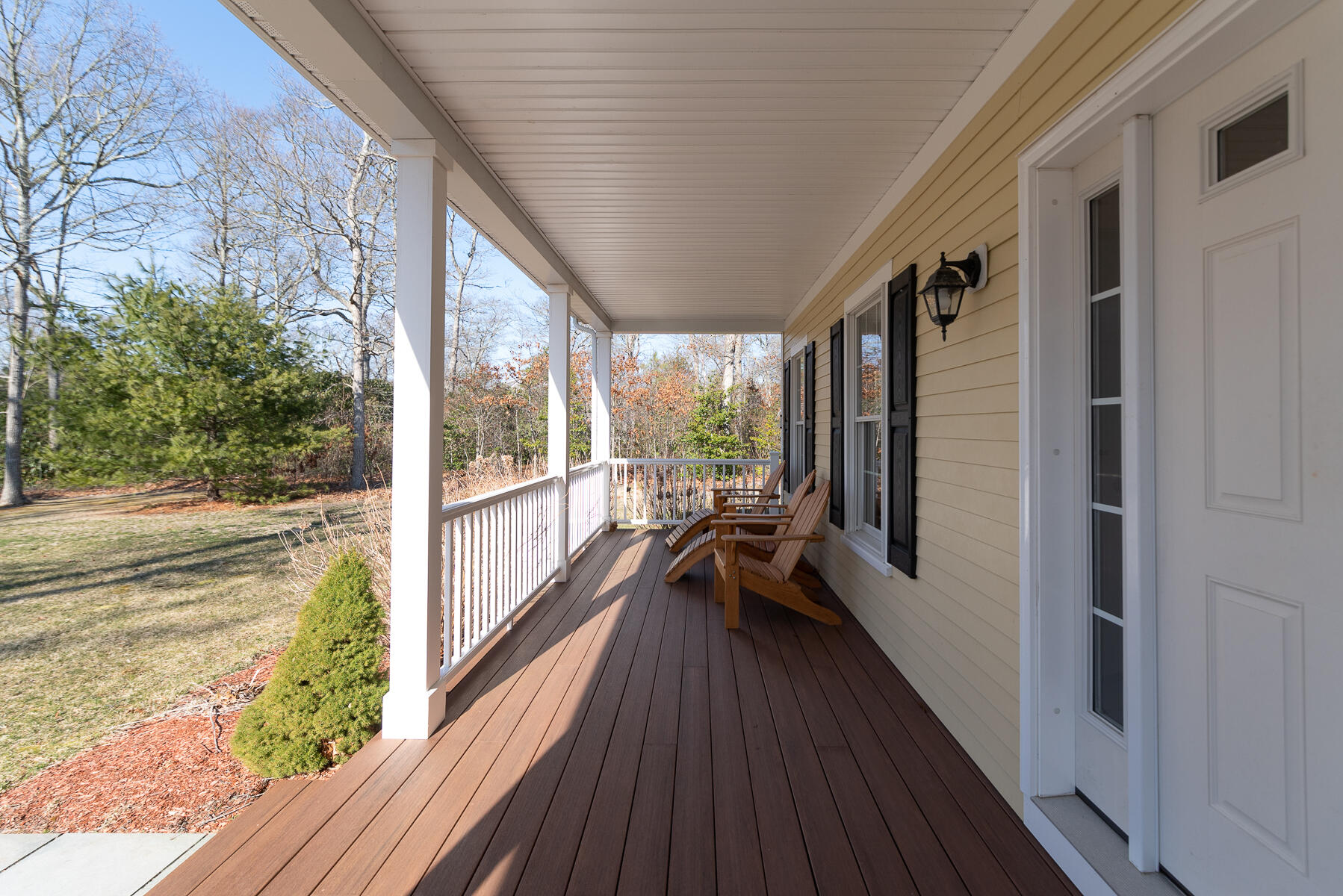 151 Tonset Road Orleans, MA 02653 - Photo 3 of 44 a view of a balcony with floor to ceiling windows with wooden floor