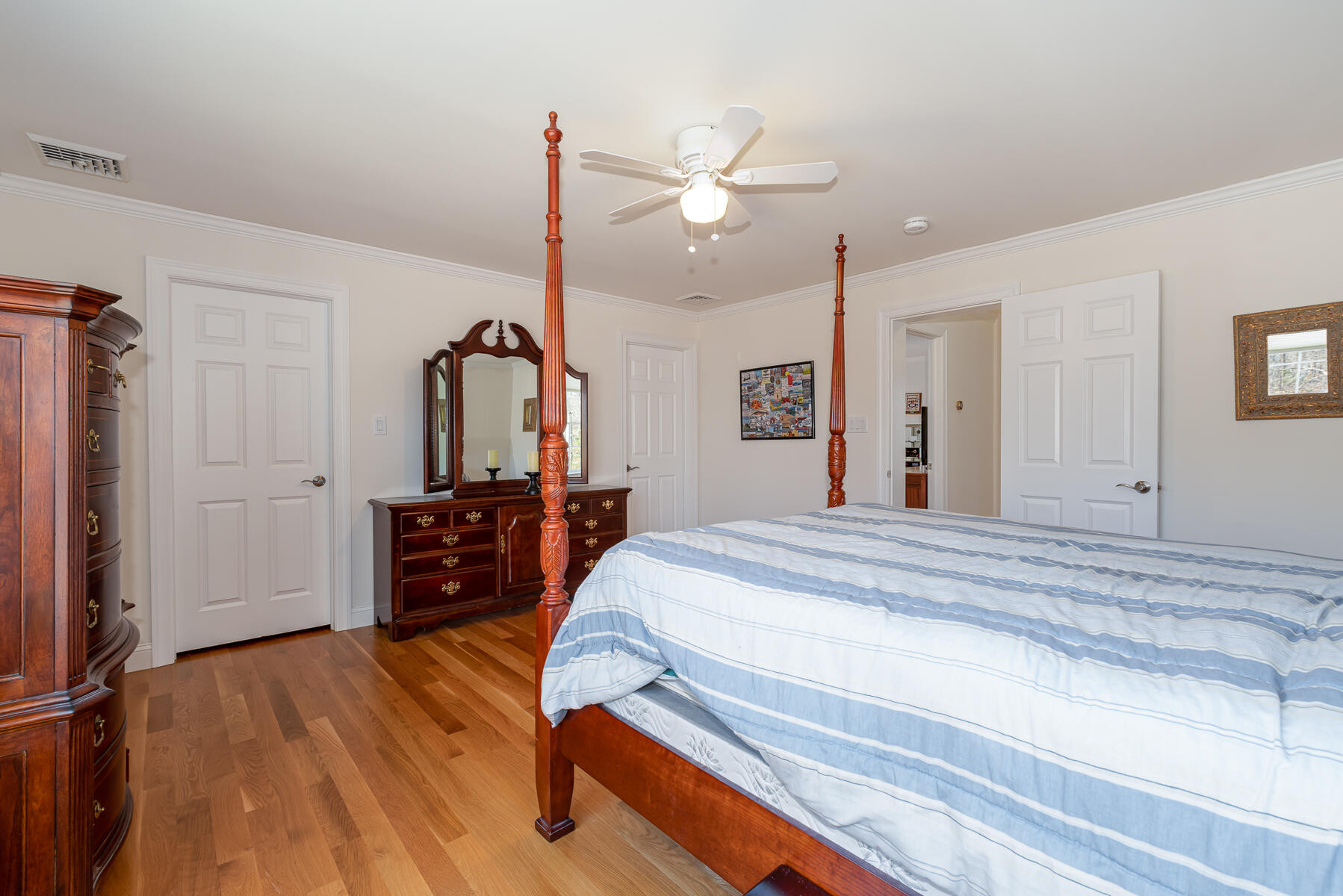 151 Tonset Road Orleans, MA 02653 - Photo 31 of 44 a bed room with a bed and a mirror