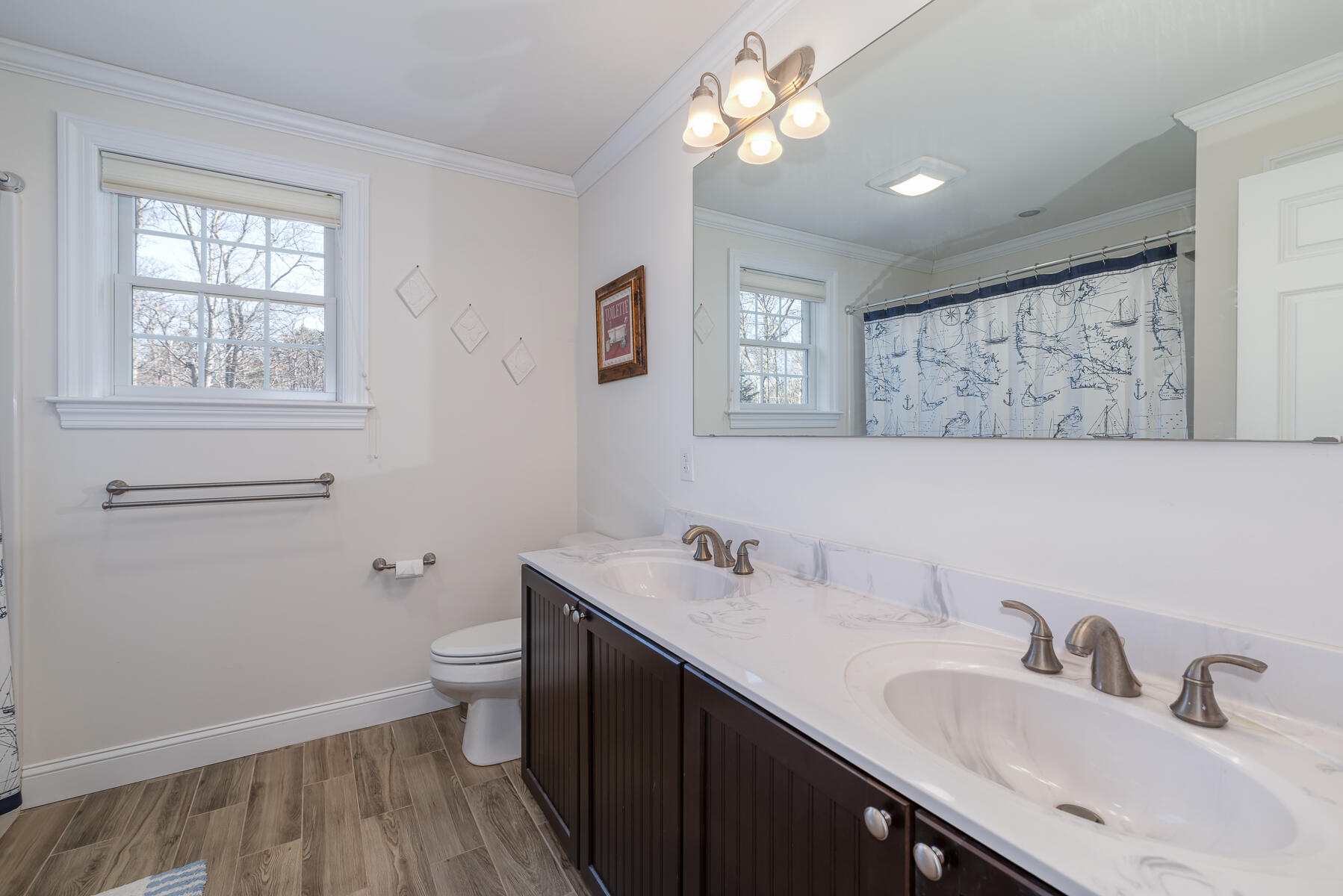 151 Tonset Road Orleans, MA 02653 - Photo 37 of 44 a bathroom with a sink a toilet and a mirror