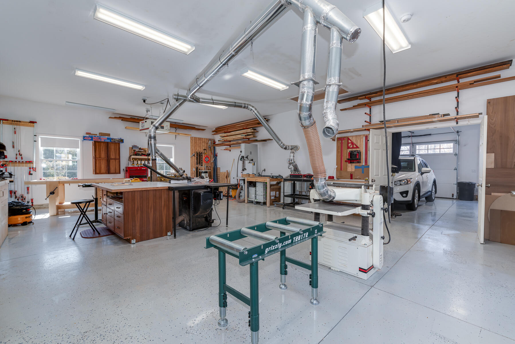 151 Tonset Road Orleans, MA 02653 - Photo 40 of 44 a living room with lots of furniture and kitchen view