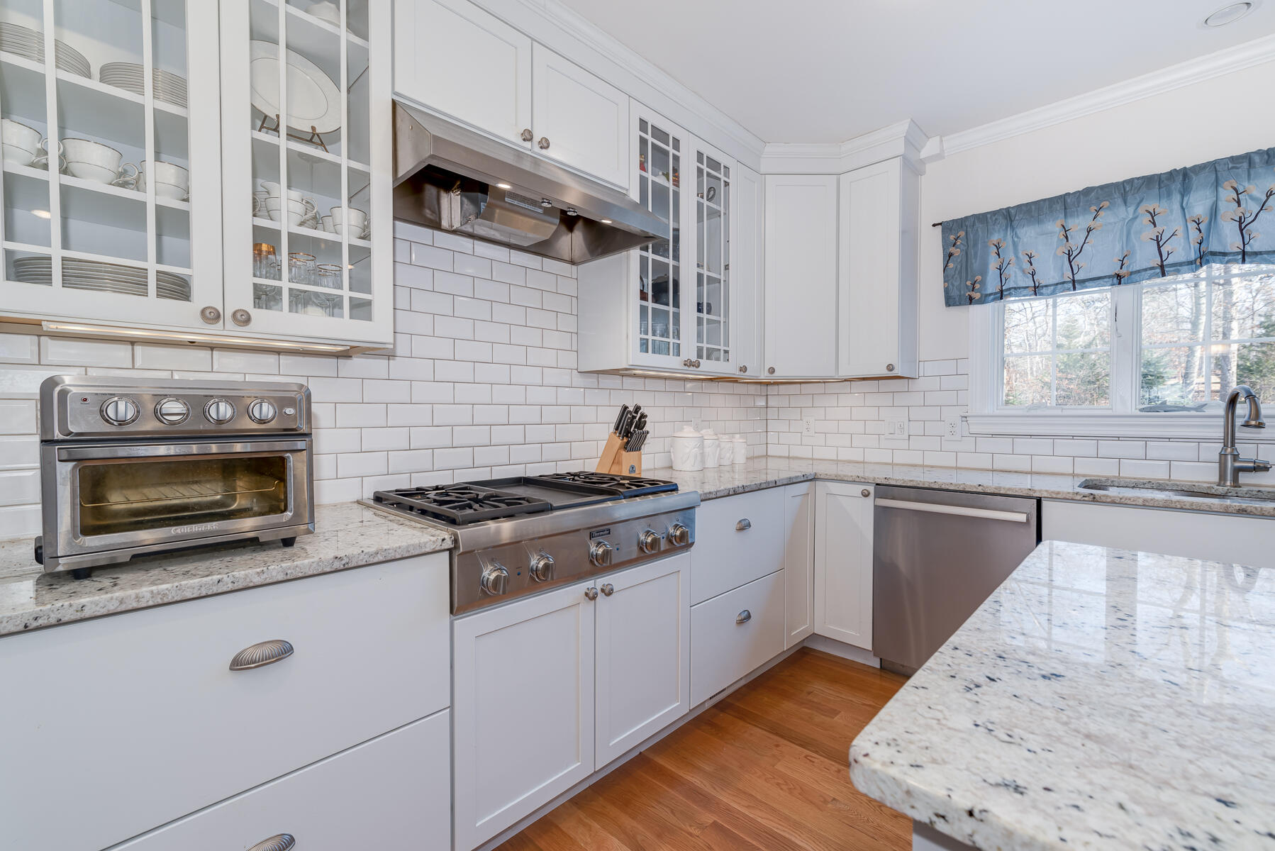 151 Tonset Road Orleans, MA 02653 - Photo 7 of 44 a kitchen with cabinets appliances a sink and a window