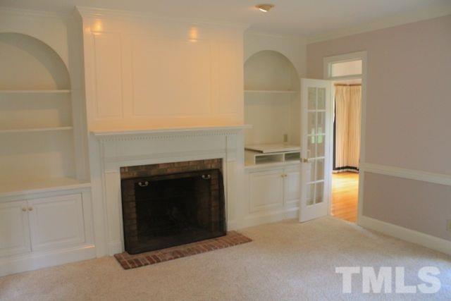 61 Gardner Road Castalia, NC 27816 - Photo 8 of 25 Spacious Family Room has built in bookshelves and real wood burning fireplace!