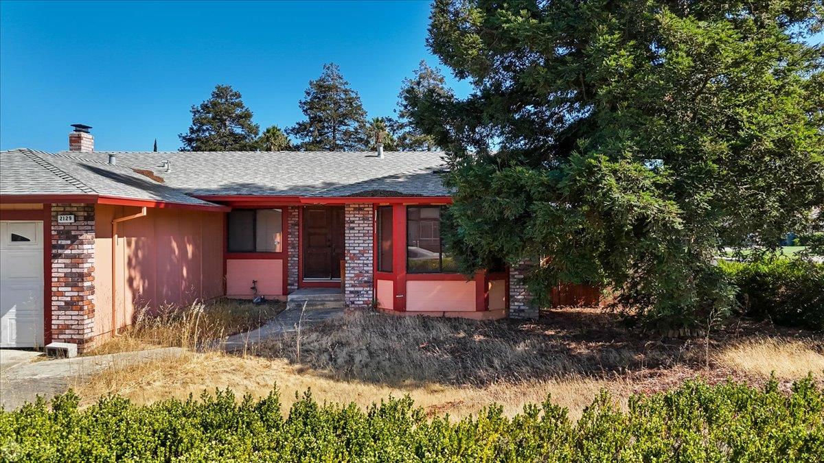 2129 Monostory Court Pittsburg, CA 94565 - Photo 8 of 18 a front view of a house with a yard