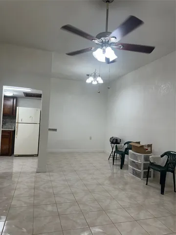 a view of a livingroom with furniture and chandelier