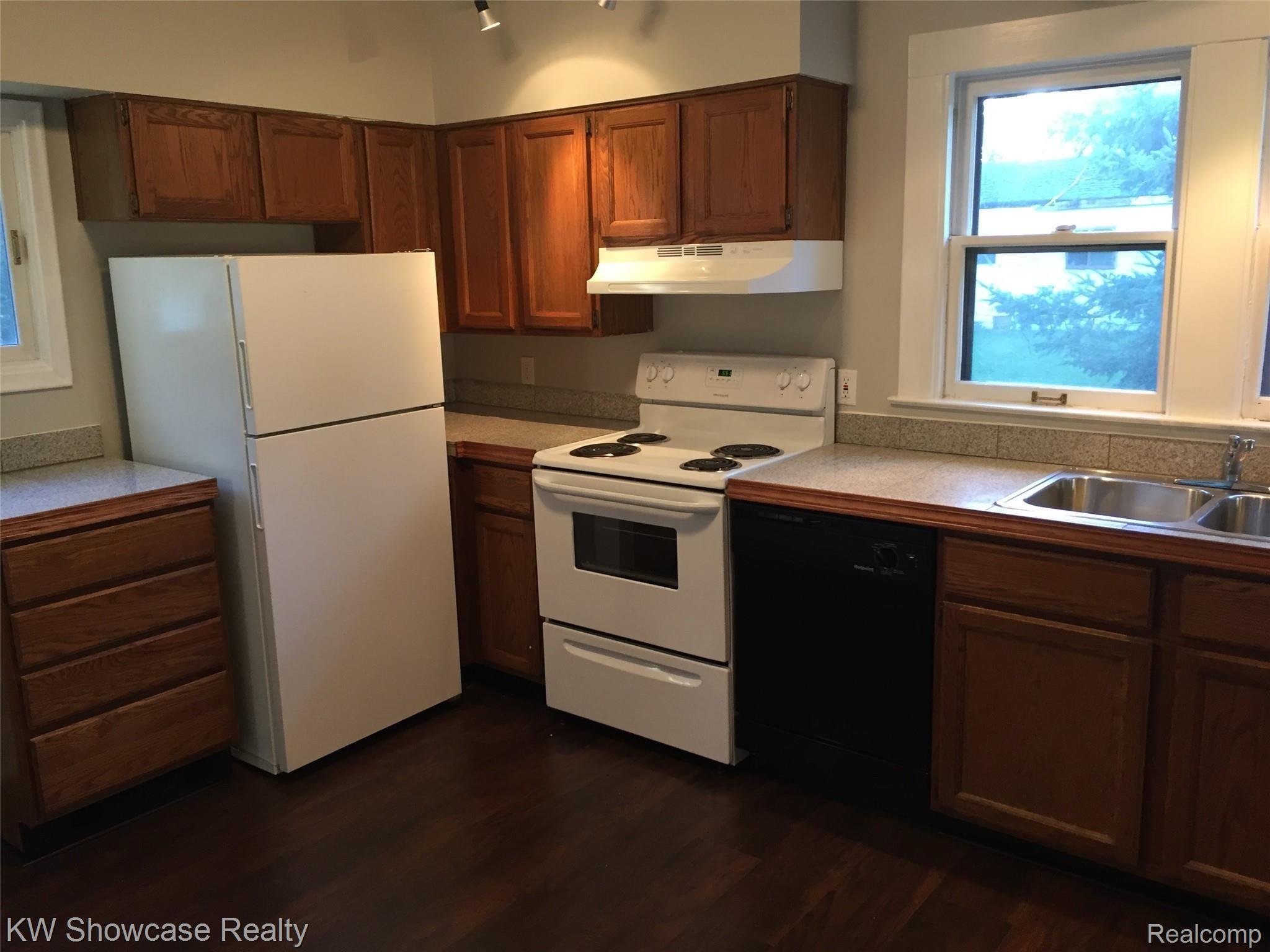 129 Ruth Avenue Pontiac, MI 48341 - Photo 11 of 36 All appliances stay, Stove/Oven, newer hood-fan, Frig and Dishwasher.