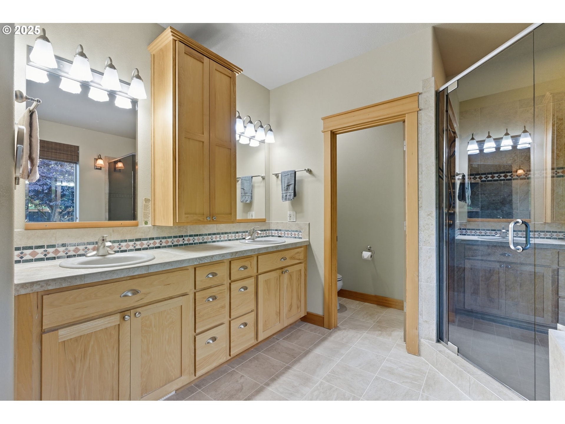 9573 South Gribble Road Canby, OR 97013 - Photo 26 of 48 a bathroom with a granite countertop sink a large mirror and a shower