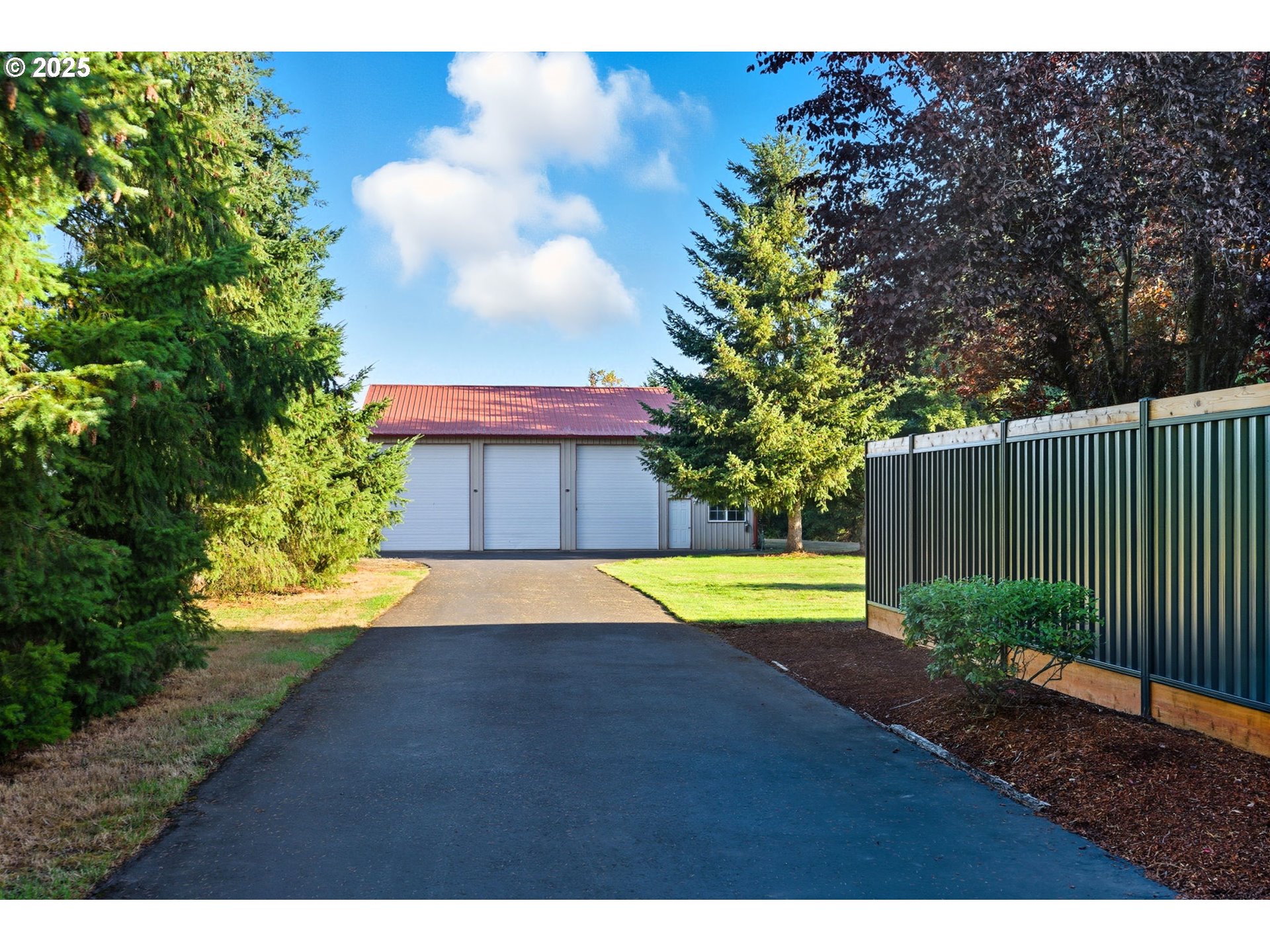 9573 South Gribble Road Canby, OR 97013 - Photo 3 of 48 a view of a backyard and swimming pool