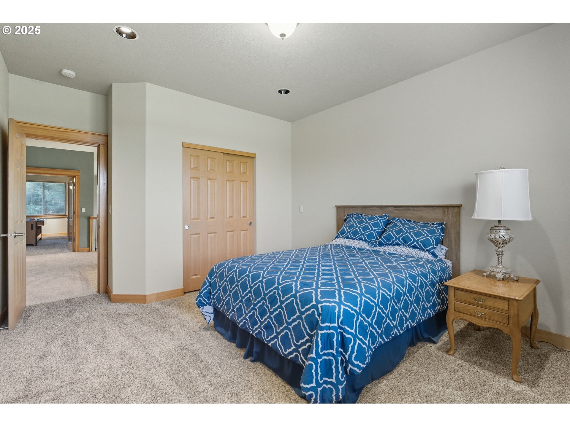 9573 South Gribble Road Canby, OR 97013 - Photo 32 of 48 a bedroom with a bed and a lamp