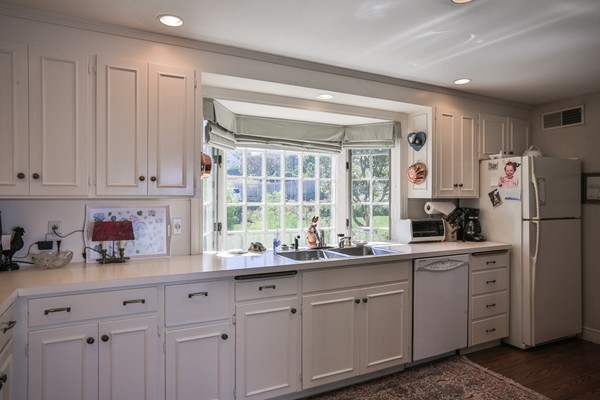 401 Jerusalem Road Cohasset, MA 02025 - Photo 11 of 29 a kitchen with white cabinets and white appliances