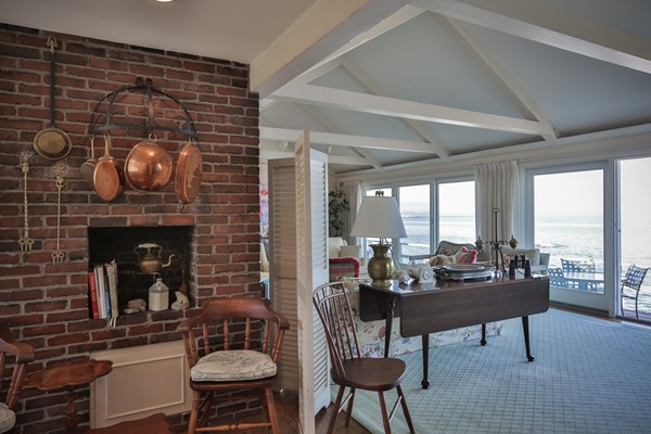 401 Jerusalem Road Cohasset, MA 02025 - Photo 12 of 29 a living room with furniture a fireplace and floor to ceiling window