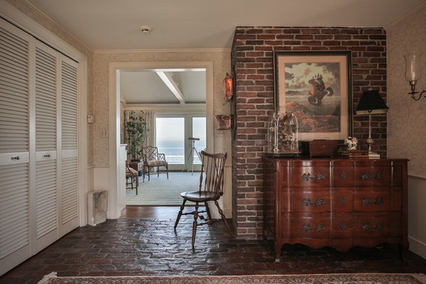 401 Jerusalem Road Cohasset, MA 02025 - Photo 13 of 29 a view of a hallway with wooden floor and a dining room
