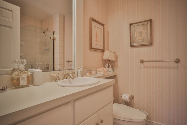 401 Jerusalem Road Cohasset, MA 02025 - Photo 15 of 29 a bathroom with a sink a toilet and mirror