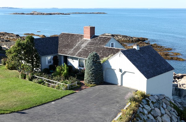 401 Jerusalem Road Cohasset, MA 02025 - Photo 2 of 29 a view of a house with a yard next to a lake