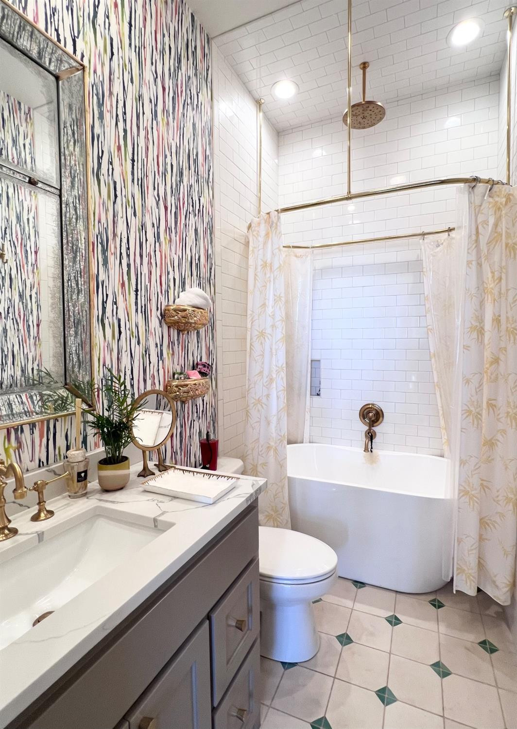 5902 112th Street Lubbock, TX 79424 - Photo 20 of 47 a bathroom with a bathtub shower sink vanity and toilet