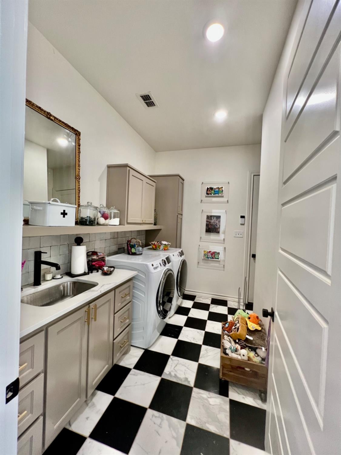 5902 112th Street Lubbock, TX 79424 - Photo 21 of 47 a kitchen with a sink a refrigerator and cabinets