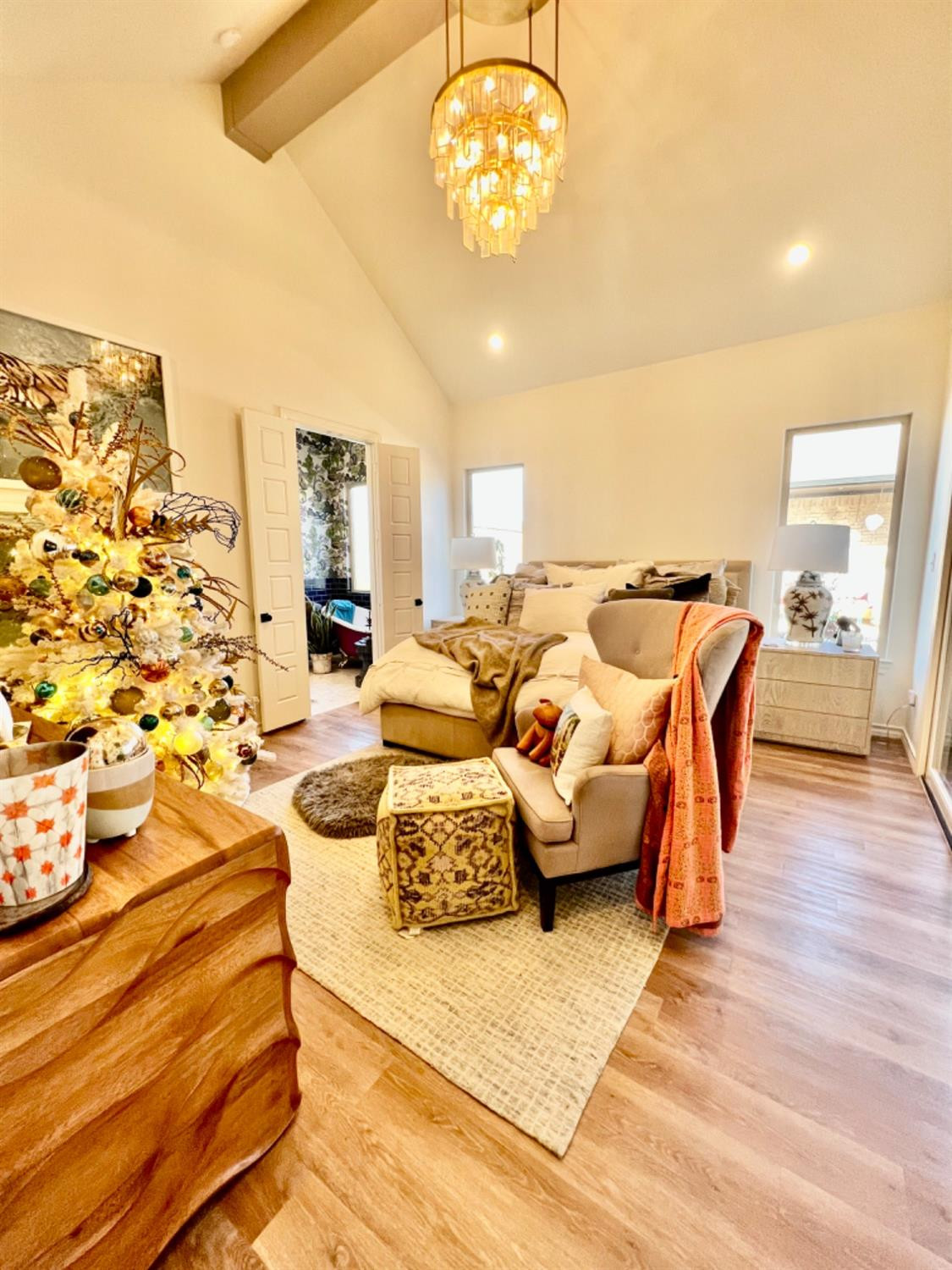 5902 112th Street Lubbock, TX 79424 - Photo 28 of 47 a view of a dining room with furniture a chandelier and wooden floor