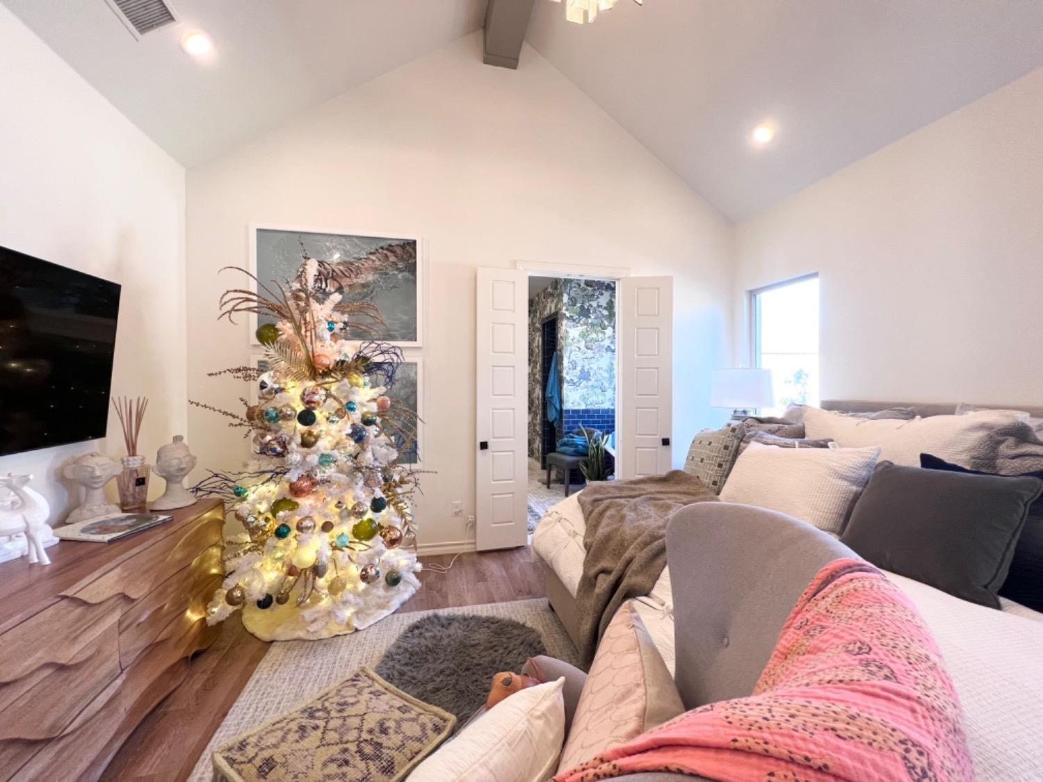 5902 112th Street Lubbock, TX 79424 - Photo 29 of 47 a living room with furniture and a flat screen tv