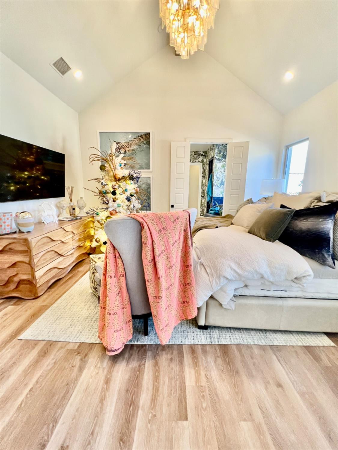 5902 112th Street Lubbock, TX 79424 - Photo 30 of 47 a bedroom with a bed and a flat screen tv