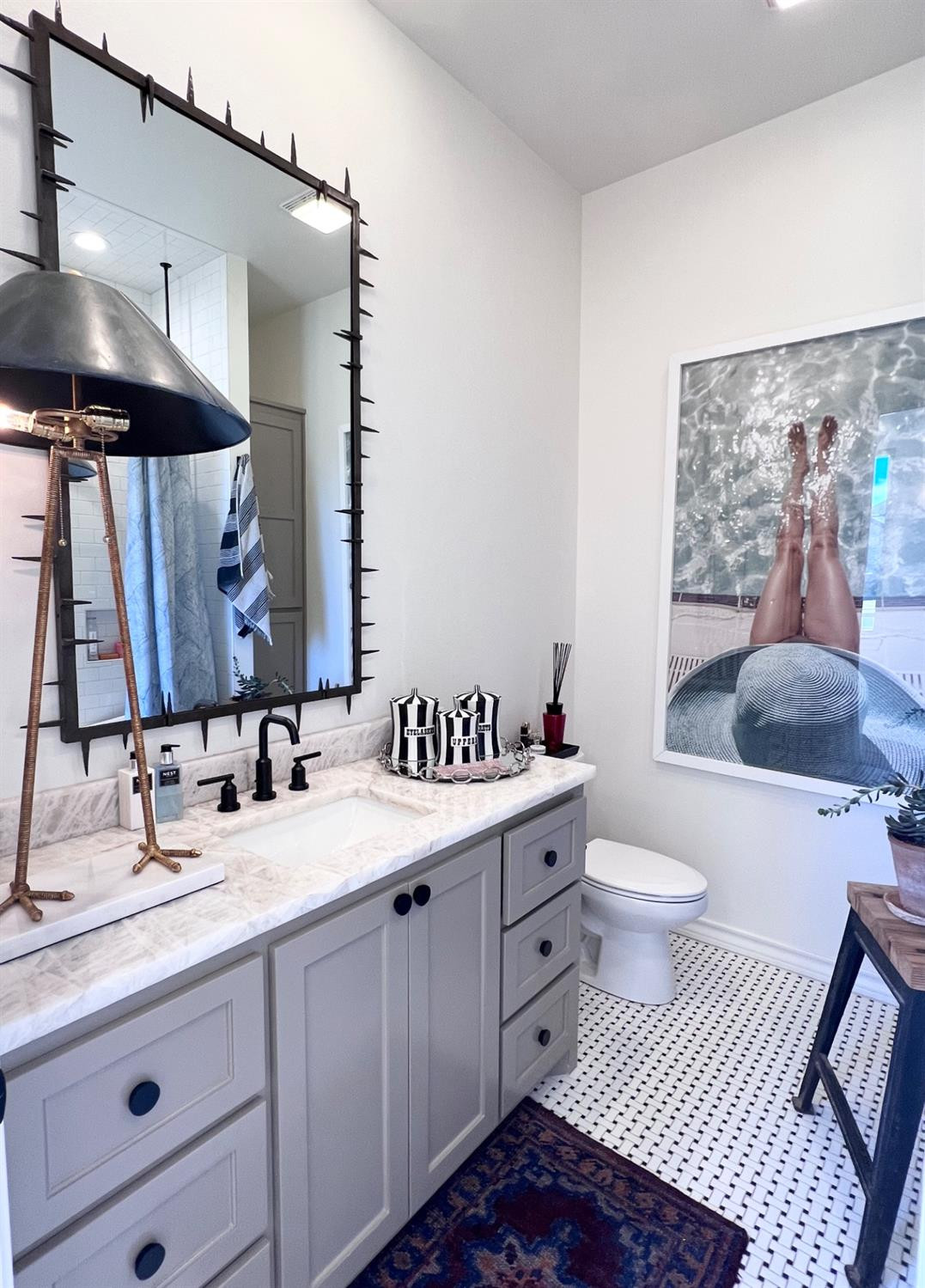 5902 112th Street Lubbock, TX 79424 - Photo 37 of 47 a bathroom with a sink and a mirror