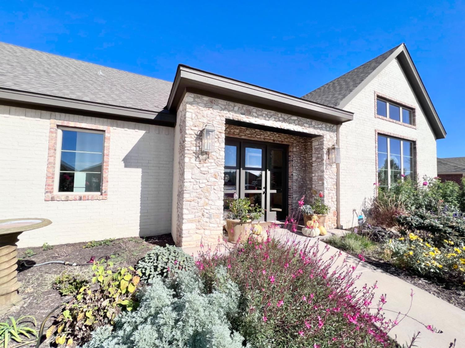 5902 112th Street Lubbock, TX 79424 - Photo 46 of 47 a front view of a house with a yard
