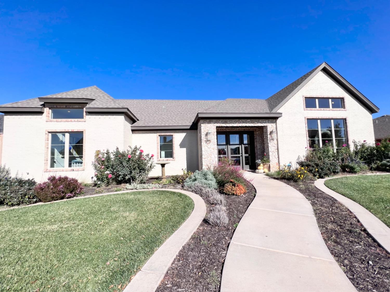 5902 112th Street Lubbock, TX 79424 - Photo 47 of 47 a front view of a house with a yard