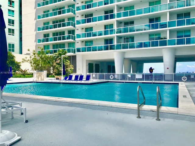 a view of swimming pool with chairs