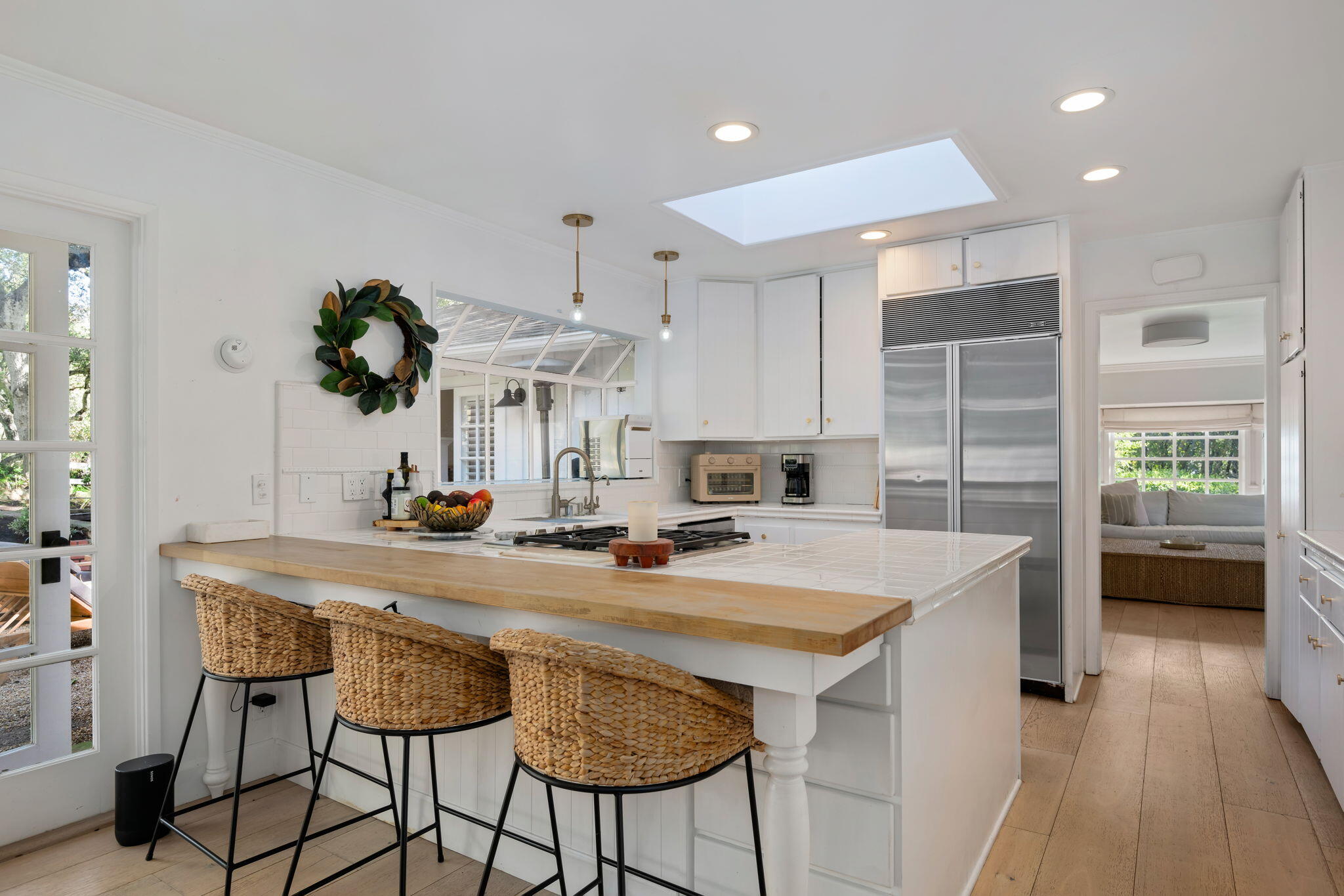 636 Oak Grove Drive Montecito, CA 93108 - Photo 7 of 17 a kitchen with a table a sink and cabinets