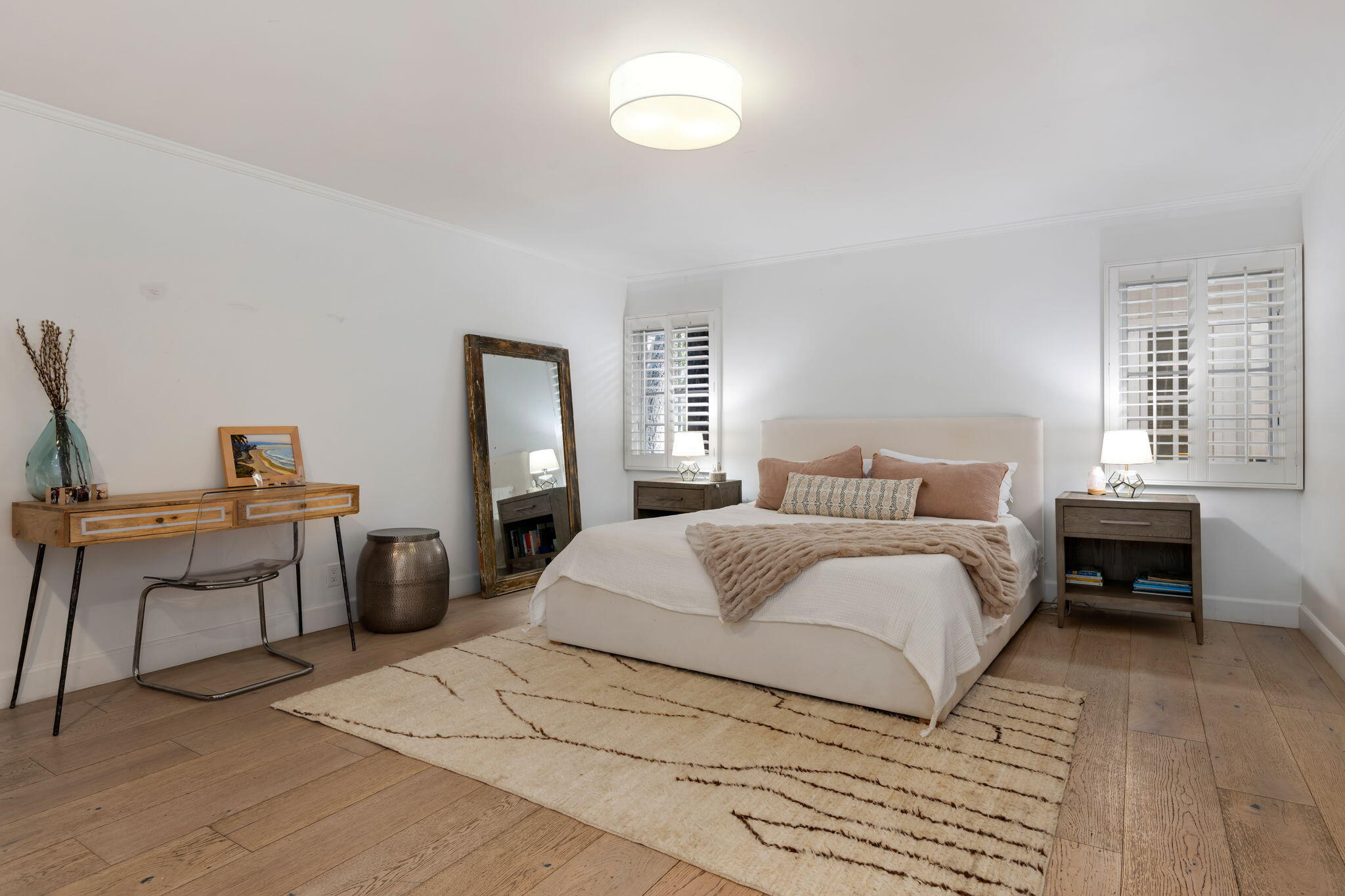 636 Oak Grove Drive Montecito, CA 93108 - Photo 10 of 17 a bedroom with a bed and a table