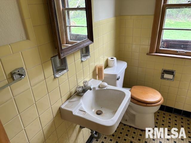 29470 Saxon Road Galva, IL 61434 - Photo 11 of 23 a bathroom with a sink a toilet and a mirror