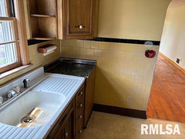 29470 Saxon Road Galva, IL 61434 - Photo 17 of 23 a kitchen with a sink and a refrigerator