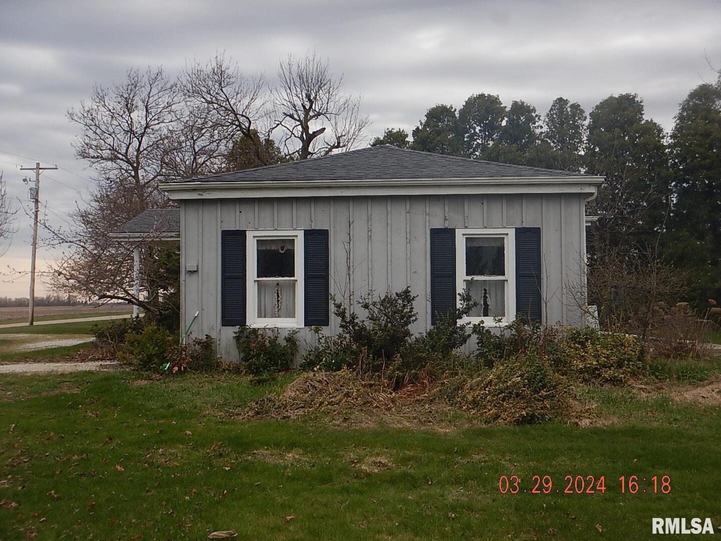 29470 Saxon Road Galva, IL 61434 - Photo 2 of 23 a front view of house with yard and green space