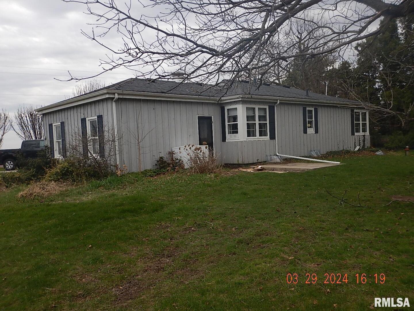 29470 Saxon Road Galva, IL 61434 - Photo 3 of 23 a backyard of a house with potted plants and large tree