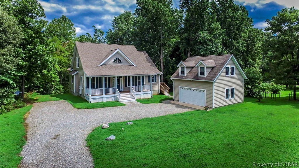 137 Mastons Wharf Road Lancaster, VA 22503 - Photo 1 of 39 a front view of a house with yard