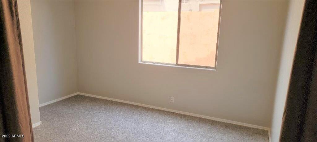 16835 South 15th Avenue Phoenix, AZ 85045 - Photo 13 of 24 an empty room with a window
