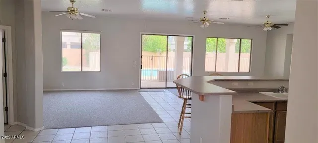 a view of a room with windows and chandelier