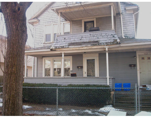 100-102 Mooreland Street Springfield, MA 01104 - Photo 1 of 1 a front view of a house with a balcony